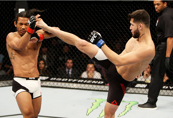SEOUL, SOUTH KOREA - NOVEMBER 28: Jorge Masvidal of the United States of America kicks Benson Henderson of the United States of America in their welterweight bout during the UFC Fight Night at the Olympic Park Gymnastics Arena on November 28, 2015 in Seo