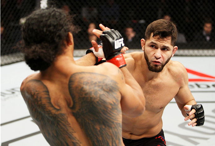 SEOUL, SOUTH KOREA - NOVEMBER 28: Jorge Masvidal of the United States of America throws a punch at Benson Henderson of the United States of America in their welterweight bout during the UFC Fight Night at the Olympic Park Gymnastics Arena on November 28,