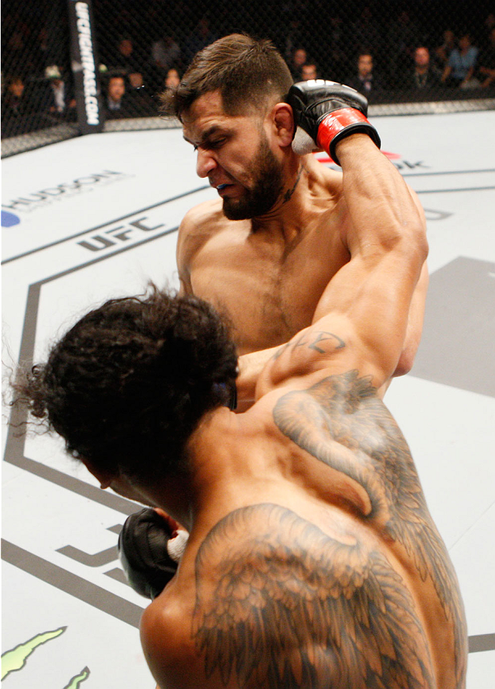 SEOUL, SOUTH KOREA - NOVEMBER 28: Benson Henderson of the United States of America punches Jorge Masvidal of the United States of America in their welterweight bout during the UFC Fight Night at the Olympic Park Gymnastics Arena on November 28, 2015 in S