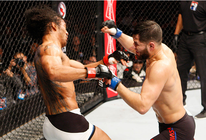 SEOUL, SOUTH KOREA - NOVEMBER 28: Jorge Masvidal of the United States of America throws a punch at Benson Henderson of the United States of America in their welterweight bout during the UFC Fight Night at the Olympic Park Gymnastics Arena on November 28,