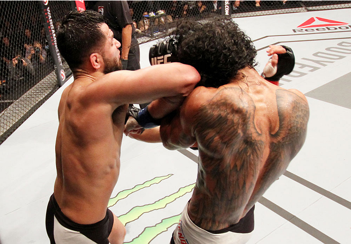 SEOUL, SOUTH KOREA - NOVEMBER 28: Jorge Masvidal of the United States of America throws an elbow on Benson Henderson of the United States of America in their welterweight bout during the UFC Fight Night at the Olympic Park Gymnastics Arena on November 28,
