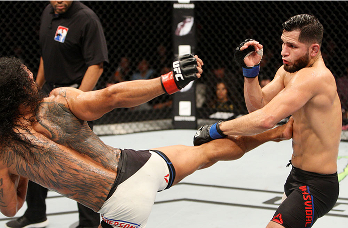 SEOUL, SOUTH KOREA - NOVEMBER 28: Benson Henderson of the United States of America kicks Jorge Masvidal of the United States of America in their welterweight bout during the UFC Fight Night at the Olympic Park Gymnastics Arena on November 28, 2015 in Seo