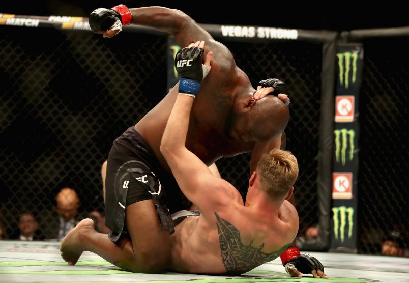 Derrick Lewis punches Alexander Volkov in their heavyweight bout during the UFC 229 event inside T-Mobile Arena on October 6, 2018 in Las Vegas, Nevada.