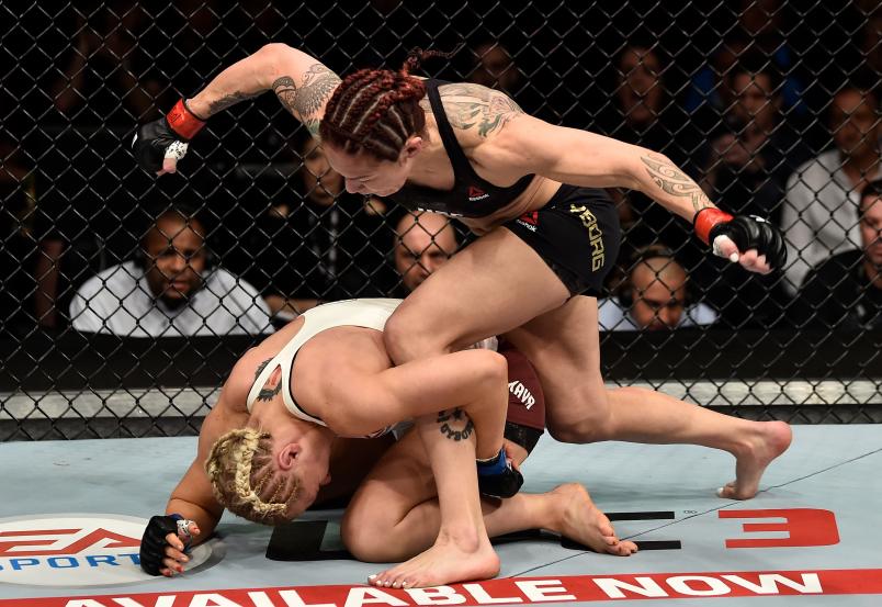 LAS VEGAS, NV - MARCH 03: (R-L) Cris Cyborg of Brazil punches Yana Kunitskaya of Russia in their women's featherweight bout during the UFC 222 event inside T-Mobile Arena on March 3, 2018 in Las Vegas, Nevada. (Photo by Jeff Bottari/Zuffa LLC via Getty Images)