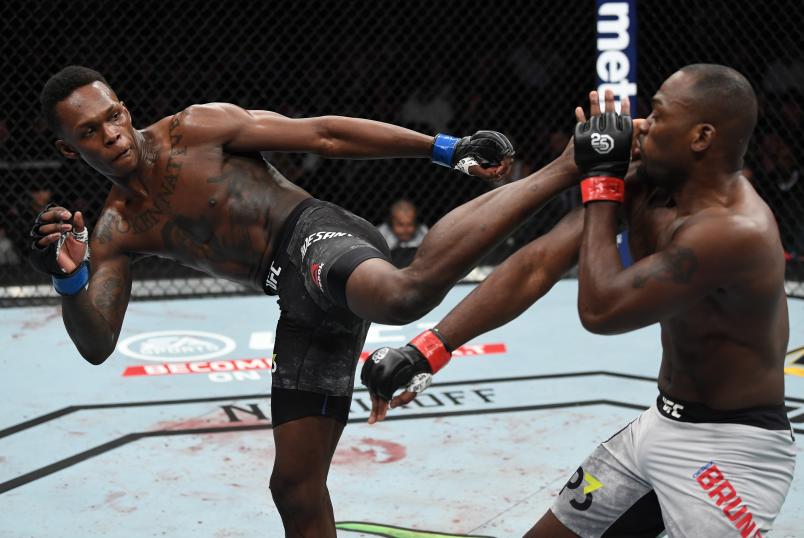NEW YORK, NY - NOVEMBER 03: (L-R) Israel Adesanya of Nigeria kicks Derek Brunson in their middleweight bout during the UFC 230 event inside Madison Square Garden on November 3, 2018 in New York, New York. (Photo by Jeff Bottari/Zuffa LLC via Getty Images)