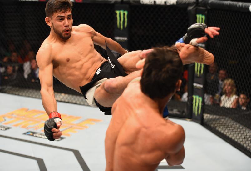 LAS VEGAS, NV - APRIL 23: (L-R) Yair Rodriguez of Mexico kicks Andre Fili in their featherweight bout during the UFC 197 event inside MGM Grand Garden Arena on April 23, 2016 in Las Vegas, Nevada. (Photo by Josh Hedges/Zuffa LLC/Zuffa LLC via Getty Images)