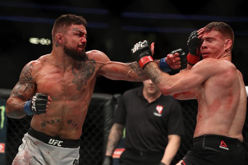 LAS VEGAS, NV - JULY 07: Mike Perry punches Paul Felder in their welterweight fight during the UFC 226 event inside T-Mobile Arena on July 7, 2018 in Las Vegas, Nevada. (Photo by Christian Petersen/Zuffa LLC via Getty Images)