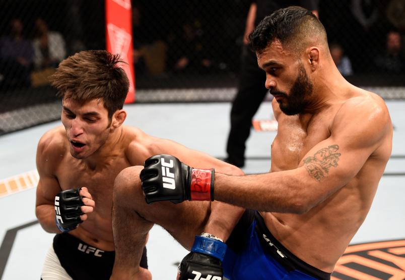 LAS VEGAS, NV - DECEMBER 03: (R-L) Rob Font knees Matt Schnell in their bantamweight bout during The Ultimate Fighter Finale event inside the Pearl concert theater at the Palms Resort & Casino on December 3, 2016 in Las Vegas, Nevada. (Photo by Jeff Bottari/Zuffa LLC/Zuffa LLC via Getty Images)