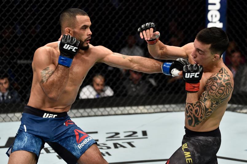 BOSTON, MA - JANUARY 20: (L-R) Rob Font punches Thomas Almeida of Brazil in their bantamweight bout during the UFC 220 event at TD Garden on January 20, 2018 in Boston, Massachusetts. (Photo by Jeff Bottari/Zuffa LLC/Zuffa LLC via Getty Images)