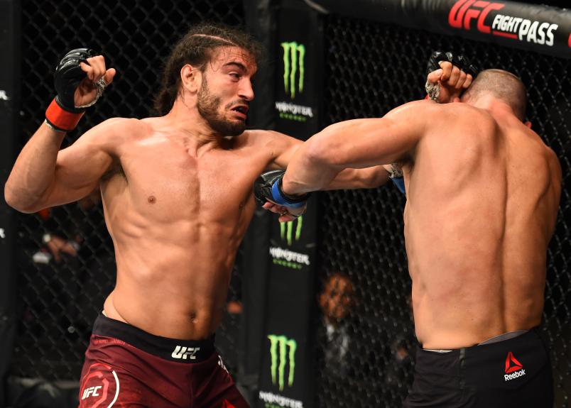 LIVERPOOL, ENGLAND - MAY 27: (L-R) Elias Theodorou of Canada punches Trevor Smith in their middleweight bout during the UFC Fight Night event at ECHO Arena on May 27, 2018 in Liverpool, England. (Photo by Josh Hedges/Zuffa LLC/Zuffa LLC via Getty Images)