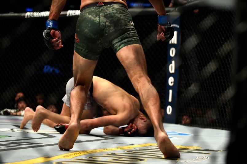 DENVER, CO - NOVEMBER 10: (L-R) Chan Sung Jung of South Korea falls to the Octagon after being knocked out by Yair Rodriguez of Mexico in their featherweight bout during the UFC Fight Night event inside Pepsi Center on November 10, 2018 in Denver, Colorado. (Photo by Chris Unger/Zuffa LLC/Zuffa LLC via Getty Images)