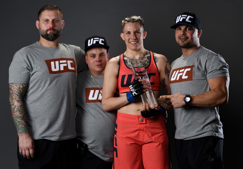 LAS VEGAS, NV - NOVEMBER 30: Macy Chiasson poses for a portrait backstage with her team after her victory over Pannie Kianzad during The Ultimate Fighter Finale event inside The Pearl concert theater at Palms Casino Resort on November 30, 2018 in Las Vegas, Nevada. (Photo by Mike Roach/Zuffa LLC/Zuffa LLC via Getty Images)