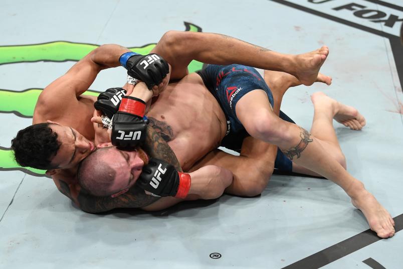 MILWAUKEE, WISCONSIN - DECEMBER 15: (L-R) Charles Oliveira of Brazil attempts to submit Jim Miller in their lightweight bout during the UFC Fight Night event at Fiserv Forum on December 15, 2018 in Milwaukee, Wisconsin. (Photo by Jeff Bottari/Zuffa LLC/Zuffa LLC via Getty Images)