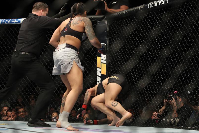 INGLEWOOD, CA - DECEMBER 29: (L-R) Amanda Nunes of Brazil punches Cris Cyborg of Brazil in their women's featherweight bout during the UFC 232 event inside The Forum on December 29, 2018 in Inglewood, California. (Photo by Christian Petersen/Zuffa LLC/Zuffa LLC via Getty Images)