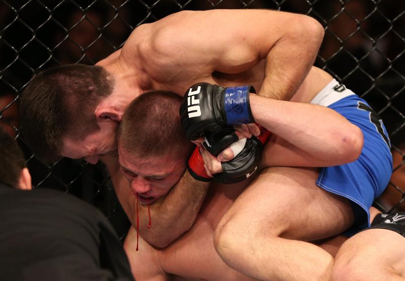 RIO DE JANEIRO, BRAZIL - OCTOBER 13: (L-R) Demian Maia secures a rear choke submission against Rick Story during their welterweight fight at UFC 153 inside HSBC Arena on October 13, 2012 in Rio de Janeiro, Brazil. (Photo by Josh Hedges/Zuffa LLC/Zuffa LLC via Getty Images)