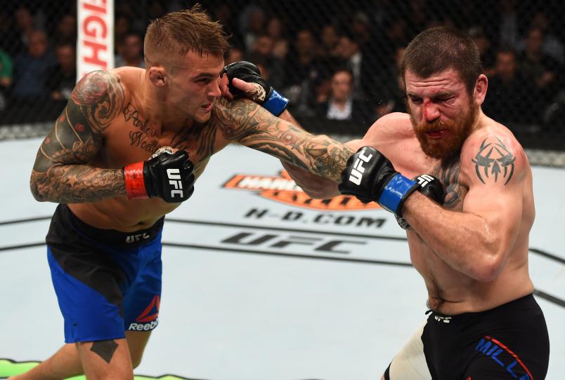 BROOKLYN, NEW YORK - FEBRUARY 11: (L-R) Dustin Poirier punches Jim Miller in their lightweight bout during the UFC 208 event inside Barclays Center on February 11, 2017 in Brooklyn, New York. (Photo by Jeff Bottari/Zuffa LLC/Zuffa LLC via Getty Images)