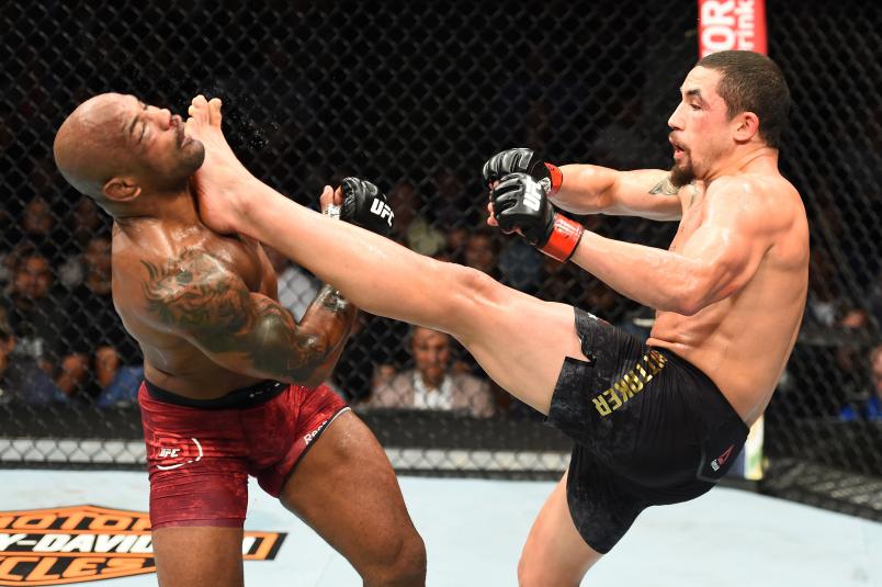 CHICAGO, ILLINOIS - JUNE 09: (R-L) Robert Whittaker of New Zealand lands a kick to the head of Yoel Romero of Cuba in their middleweight fight during the UFC 225 event at the United Center on June 9, 2018 in Chicago, Illinois. (Photo by Josh Hedges/Zuffa LLC/Zuffa LLC via Getty Images)