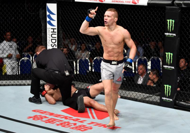 SINGAPORE - JUNE 23: Petr Yan of Russia celebrates after his knockout victory over Teruto Ishihara of Japan in their bantamweight bout during the UFC Fight Night event at the Singapore Indoor Stadium on June 23, 2018 in Singapore. (Photo by Jeff Bottari/Zuffa LLC/Zuffa LLC via Getty Images)