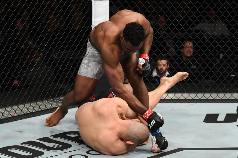 Francis Ngannou of Cameroon (top) punches Cain Velasquez in their heavyweight bout during the UFC Fight Night event at Talking Stick Resort Arena on February 17, 2019 in Phoenix, Arizona. (Photo by Josh Hedges/Zuffa LLC/Zuffa LLC via Getty Images)