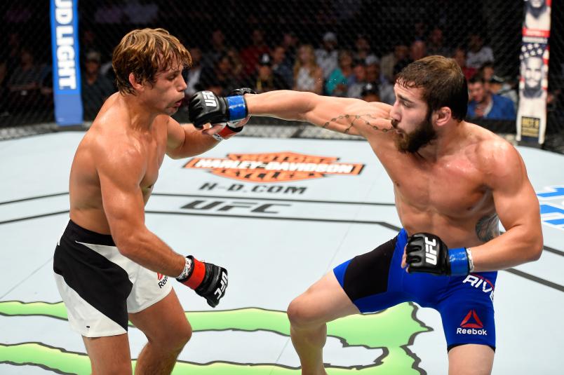 CLEVELAND, OH - SEPTEMBER 10: (R-L) Jimmie Rivera punches Urijah Faber in their bantamweight bout during the UFC 203 event at Quicken Loans Arena on September 10, 2016 in Cleveland, Ohio. (Photo by Josh Hedges/Zuffa LLC/Zuffa LLC via Getty Images)
