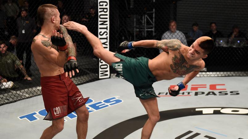FRESNO, CA - DECEMBER 09: (L-R) Benito Lopez kicks Albert Morales in their bantamweight bout during the UFC Fight Night event inside Save Mart Center on December 9, 2017 in Fresno, California. (Photo by Jeff Bottari/Zuffa LLC/Zuffa LLC via Getty Images)