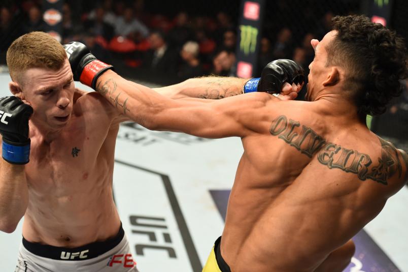 DETROIT, MI - DECEMBER 02: (L-R) Paul Felder punches Charles Oliveira of Brazil in their lightweight bout during the UFC 218 event inside Little Caesars Arena on December 02, 2017 in Detroit, Michigan. (Photo by Josh Hedges/Zuffa LLC/Zuffa LLC via Getty Images)