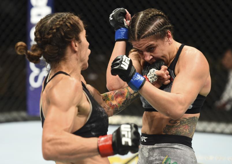 BOISE, ID - JULY 14: (L-R) Liz Carmouche punches Jennifer Maia of Brazil in their women's flyweight fight during the UFC Fight Night event inside CenturyLink Arena on July 14, 2018 in Boise, Idaho. (Photo by Josh Hedges/Zuffa LLC/Zuffa LLC via Getty Images)