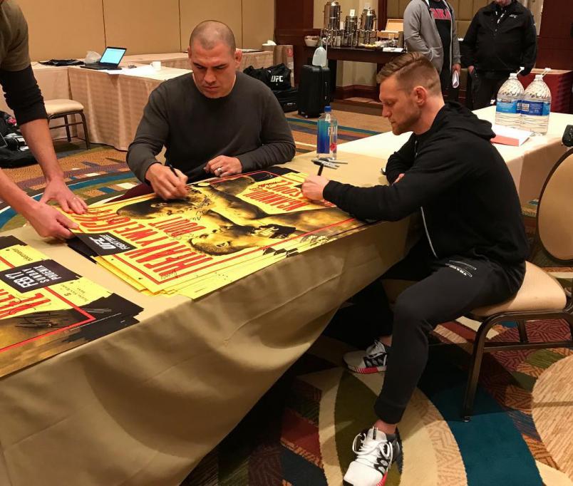 Cain Velasquez and Scott Holtzman Sign Posters For UFC Phoenix