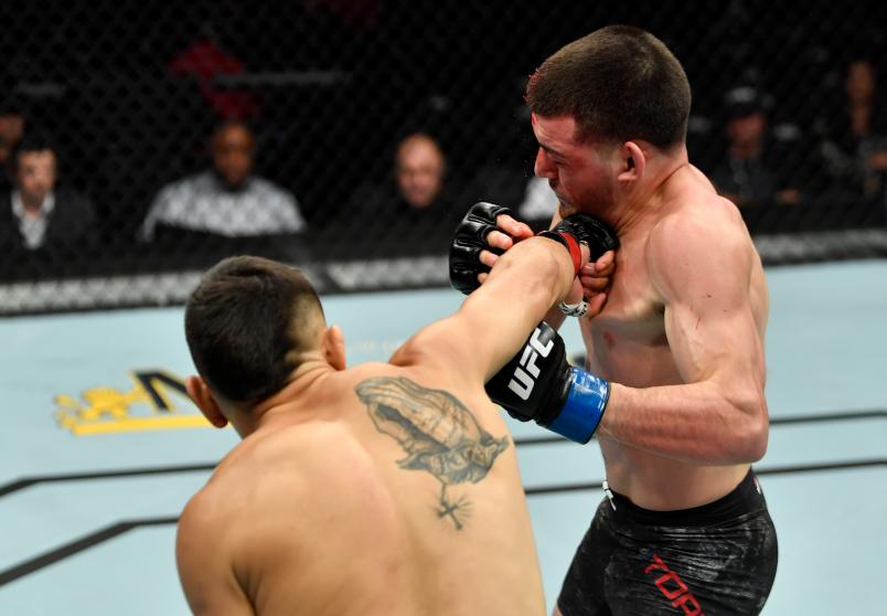 LOS ANGELES, CA - AUGUST 04: (L-R) Alex Perez punches Jose Torres in their flyweight fight during the UFC 227 event inside Staples Center on August 4, 2018 in Los Angeles, California. (Photo by Jeff Bottari/Zuffa LLC/Zuffa LLC via Getty Images)