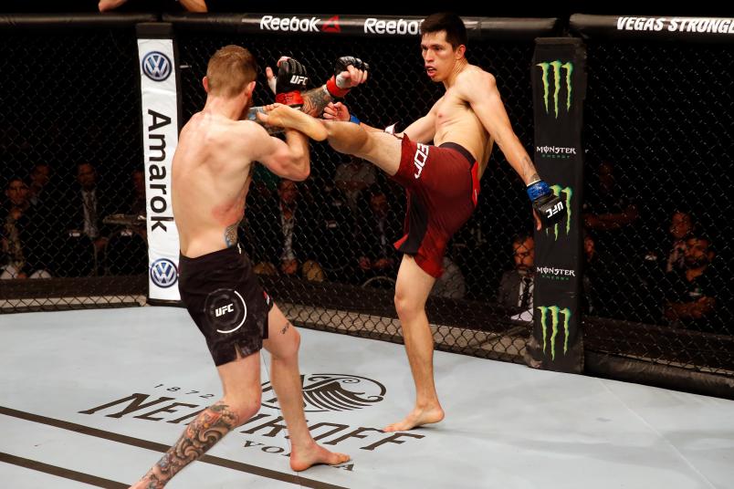 BUENOS AIRES, ARGENTINA - NOVEMBER 17: (R-L) Jesus Pinedo of Peru kicks Devin Powell in their lightweight bout during the UFC Fight Night event inside Arena Parque Roca on November 17, 2018 in Buenos Aires, Argentina. (Photo by Alexandre Schneider/Zuffa LLC/Zuffa LLC via Getty Images)