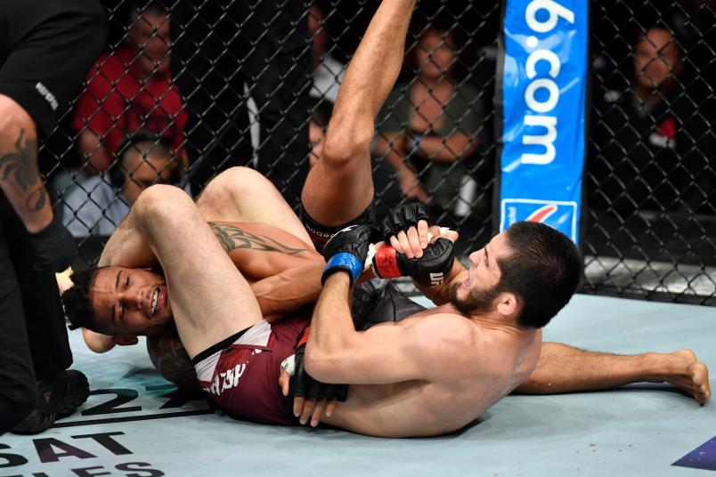CALGARY, AB - JULY 28: (R-L) Islam Makhachev of Russia secures an arm bar submission against Kajan Johnson of Canada in their lightweight bout during the UFC Fight Night event at Scotiabank Saddledome on July 28, 2018 in Calgary, Alberta, Canada. (Photo by Jeff Bottari/Zuffa LLC/Zuffa LLC via Getty Images)