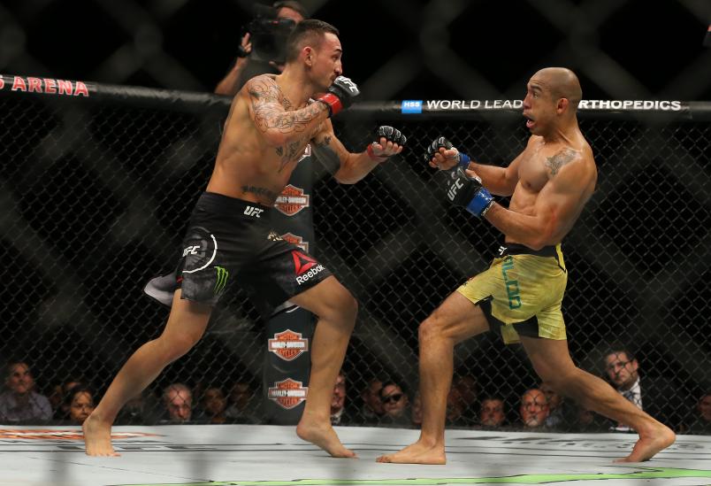 DETROIT, MI - DECEMBER 2: (R-L) Jose Aldo battles Max Holloway during the UFC 218 event at Little Caesars Arena on December 2, 2017 in Detroit, Michigan. (Photo by Rey Del Rio/Zuffa LLC via Getty Images)