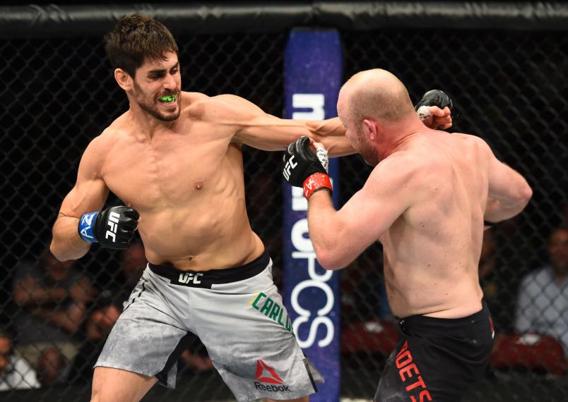 GLENDALE, AZ - APRIL 14: (L-R) Antonio Carlos Junior of Brazil punches Tim Boetsch in their middleweight fight during the UFC Fight Night event at the Gila Rivera Arena on April 14, 2018 in Glendale, Arizona. (Photo by Josh Hedges/Zuffa LLC/Zuffa LLC via Getty Images)
