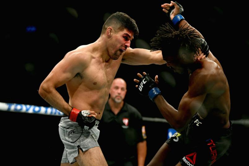 LAS VEGAS, NV - OCTOBER 06: Vicente Luque (L) punches Jalin Turner in their welterweight bout during the UFC 229 event inside T-Mobile Arena on October 6, 2018 in Las Vegas, Nevada. (Photo by Harry How/Getty Images)