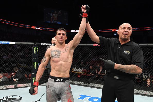 Alex White celebrates after defeating Dan Moret