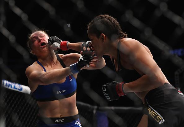 LAS VEGAS, NV - DECEMBER 30: (R-L) Amanda Nunes of Brazil punches Ronda Rousey in their UFC women's bantamweight championship bout during the UFC 207 event on December 30, 2016 in Las Vegas, Nevada. (Photo by Christian Petersen/Getty Images)