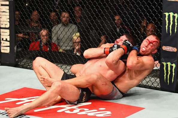 NEW YORK, NY - NOVEMBER 04: Georges St-Pierre of Canada pins Michael Bisping of England in their UFC middleweight championship bout during the UFC 217 event at Madison Square Garden on November 4, 2017 in New York City. (Photo by Josh Hedges/Zuffa LLC/Zu