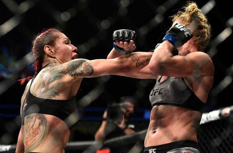 LAS VEGAS, NV - DECEMBER 30: (L-R) Cris Cyborg of Brazil punches Holly Holm in their women's featherweight bout during the UFC 219 event inside T-Mobile Arena on December 30, 2017 in Las Vegas, Nevada. (Photo by Brandon Magnus/Zuffa LLC/Zuffa LLC via Get