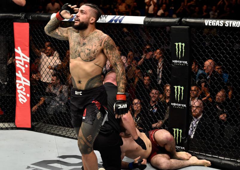 PERTH, AUSTRALIA - FEBRUARY 11: (L-R) Tyson Pedro of Australia celebrates his submission victory over Saparbek Safarov of Russiain their light heavyweight bout during the UFC 221 event at Perth Arena on February 11, 2018 in Perth, Australia. (Photo by J