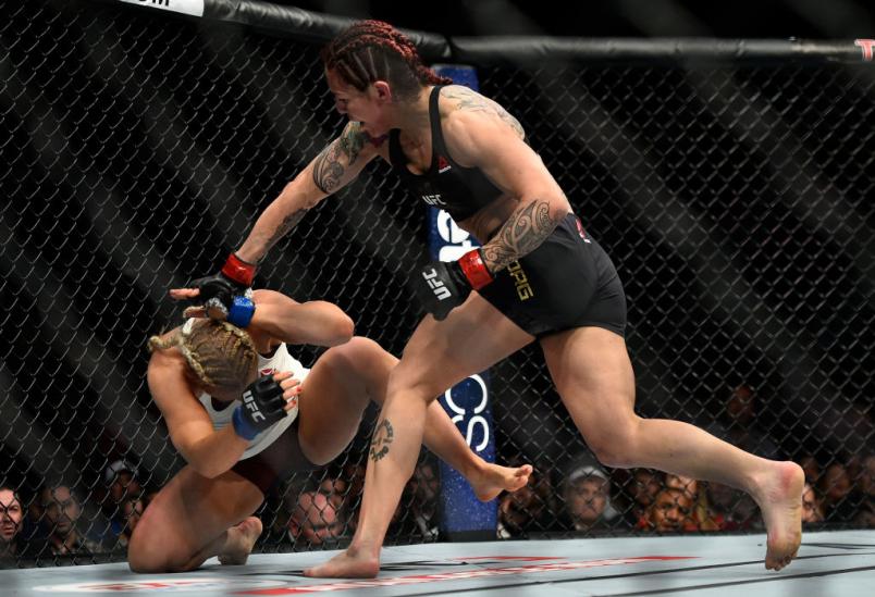 LAS VEGAS, NV - MARCH 03: (R-L) Cris Cyborg of Brazil punches Yana Kunitskaya of Russia in their women's featherweight bout during the UFC 222 event inside T-Mobile Arena on March 3, 2018 in Las Vegas, Nevada. (Photo by Brandon Magnus/Zuffa LLC/Zuffa LL