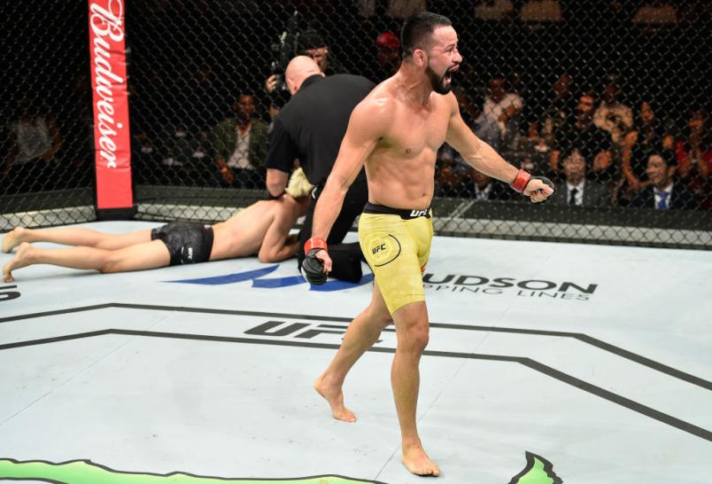 SAITAMA, JAPAN - SEPTEMBER 22: (R-L) Jussier Formiga of Brazil celebrates his submission victory over Ulka Sasaki of Japan in their featherweight bout during the UFC Fight Night event inside the Saitama Super Arena on September 22, 2017 in Saitama, Japan