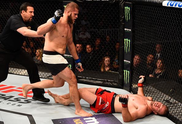 SALT LAKE CITY, UT - AUGUST 06: (L-R) Marcin Tybura of Poland celebrates his knockout victory over Viktor Pesta of the Czech Republic in their heavyweight bout during the UFC Fight Night event at Vivint Smart Home Arena on August 6, 2016 in Salt Lake C