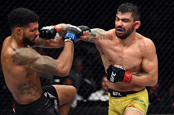 SAO PAULO, BRAZIL - OCTOBER 28: (R-L) Elizeu Zaleski dos Santos of Brazil punches Max Griffin in their welterweight bout during the UFC Fight Night event inside the Ibirapuera Gymnasium on October 28, 2017 in Sao Paulo, Brazil. (Photo by Josh Hedges/Zuff