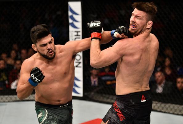SHANGHAI, CHINA - NOVEMBER 25: Kelvin Gastelum punches Michael Bisping of England in their middleweight bout during the UFC Fight Night event inside the Mercedes-Benz Arena on November 25, 2017 in Shanghai, China. (Photo by Brandon Magnus/Zuffa LLC via G