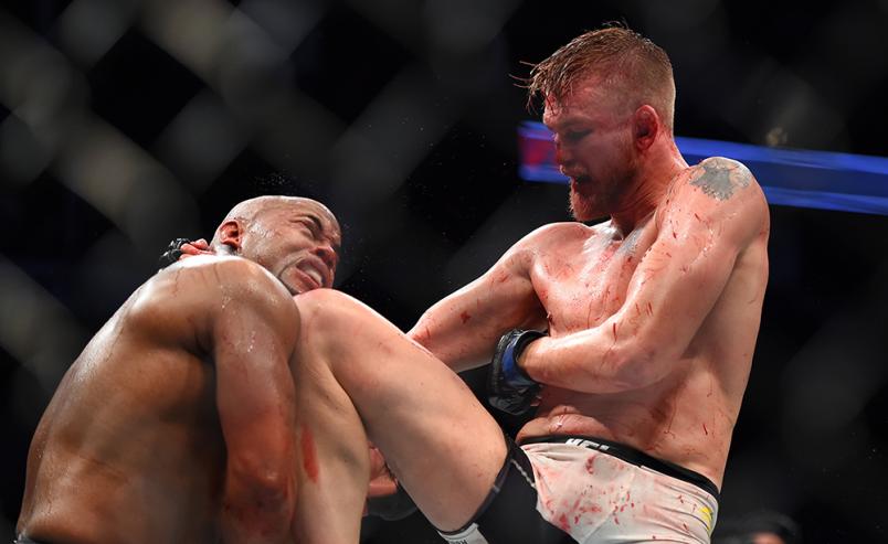 HOUSTON, TX - OCTOBER 03: (R-L) Alexander Gustafsson lands a knee to the chin of Daniel Cormier in their UFC light heavyweight championship bout during the UFC 192 event at the Toyota Center on October 3, 2015 in Houston, Texas. (Photo by Jeff Bottari/Zu