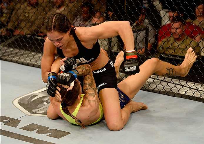 FORT CAMPBELL, KENTUCKY - NOVEMBER 6: Amanda Nunes (top) punches Germaine de Randamie in their UFC women's bantamweight bout on November 6, 2013 in Fort Campbell, Kentucky. (Photo by Jeff Bottari/Zuffa LLC/Zuffa LLC via Getty Images) *** Local Caption **