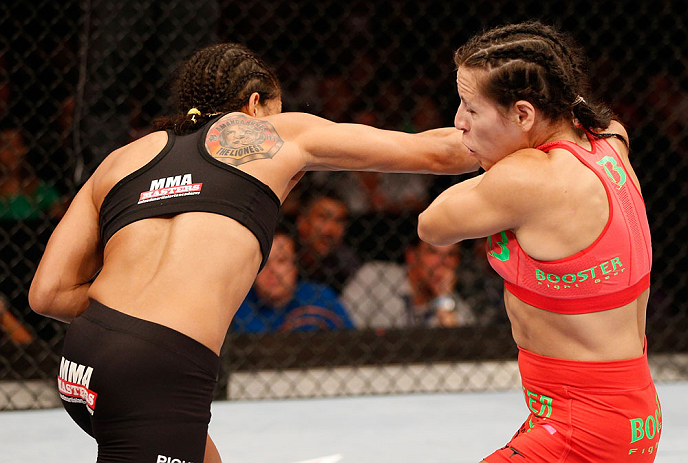 RIO DE JANEIRO, BRAZIL - AUGUST 03: (L-R) Amanda Nunes punches Sheila Gaff in their women's bantamweight bout during UFC 163 at HSBC Arena on August 3, 2013 in Rio de Janeiro, Brazil. (Photo by Josh Hedges/Zuffa LLC/Zuffa LLC via Getty Images)