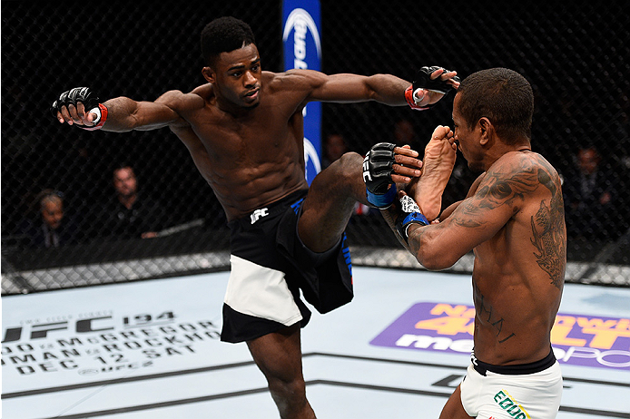 LAS VEGAS, NEVADA - DECEMBER 10: (L) Aljamain Sterling kicks Johnny Eduardo in their bantamweight bout during the UFC Fight Night event at The Chelsea at the Cosmopolitan of Las Vegas on December 10, 2015 in Las Vegas, Nevada. (Photo by Jeff Bottari/Zuf