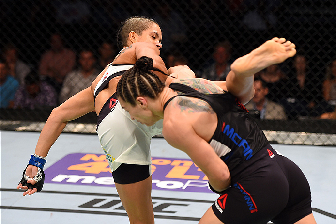 NASHVILLE, TN - AUGUST 08: (L-R) Amanda Nunes of Brazil attempts a kick against Sara McMann in their women's bantamweight bout during the UFC Fight Night event at Bridgestone Arena on August 8, 2015 in Nashville, Tennessee. (Photo by Josh Hedges/Zuffa L