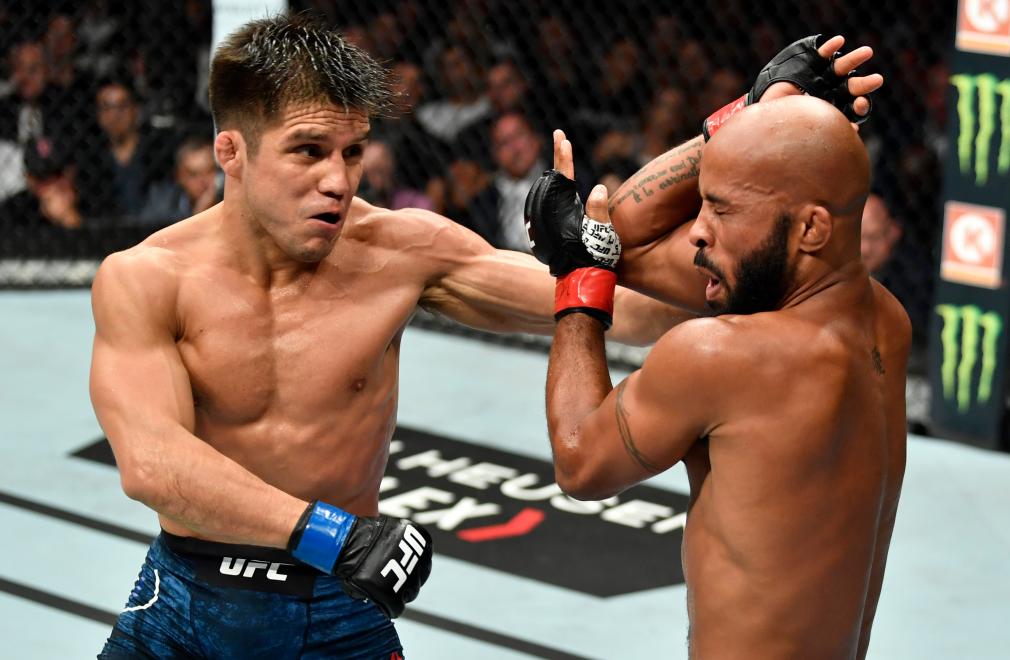 LOS ANGELES, CA - AUGUST 04: (L-R) Henry Cejudo punches Demetrious Johnson in their UFC flyweight championship fight during the UFC 227 event inside Staples Center on August 4, 2018 in Los Angeles, California. (Photo by Jeff Bottari/Zuffa LLC/Zuffa LLC via Getty Images)